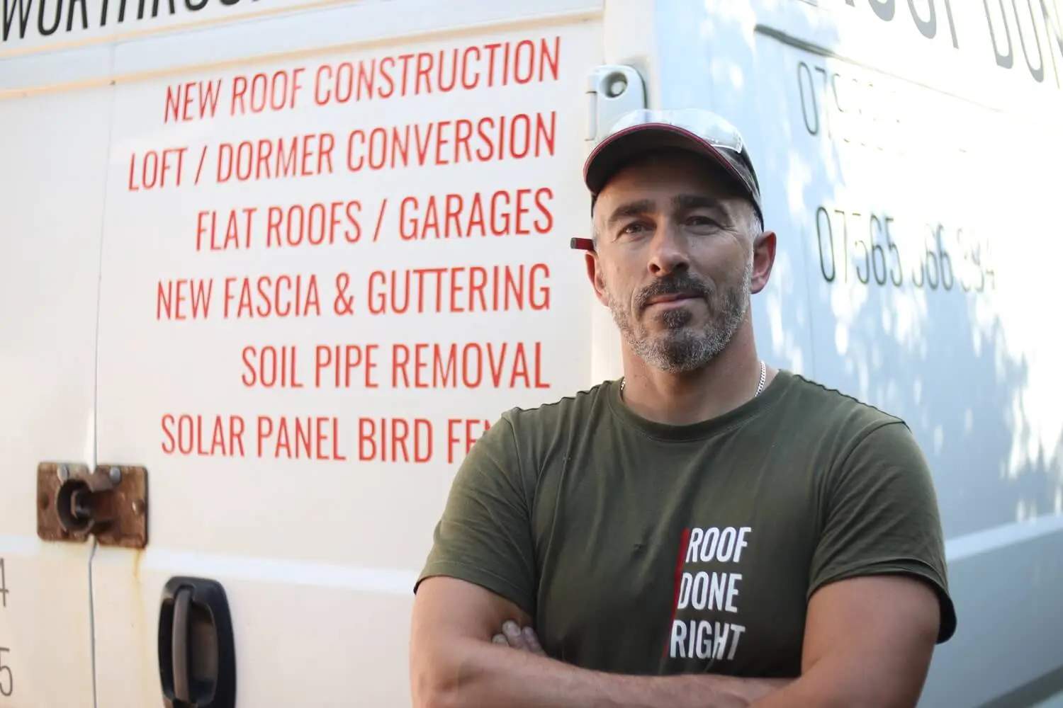 Roofing Company Director Lukas Standing next to the truck